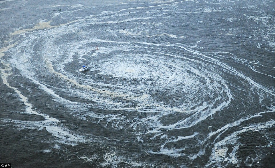 Tsunami swirls near a port in Oarai, Ibaraki Prefecture 