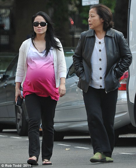 Team work: Miss Hong was joined on her walk by a friend