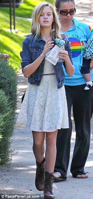 Like mother like daughter: Reese and her daughter Ava looked very much alike as they made their way to a birthday party on Saturday