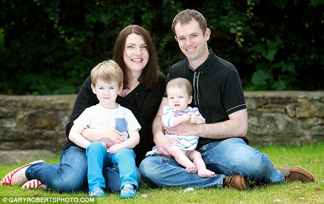 Miracle: Pictured are 'twins' Charlie and Georgina, with their delighted parents