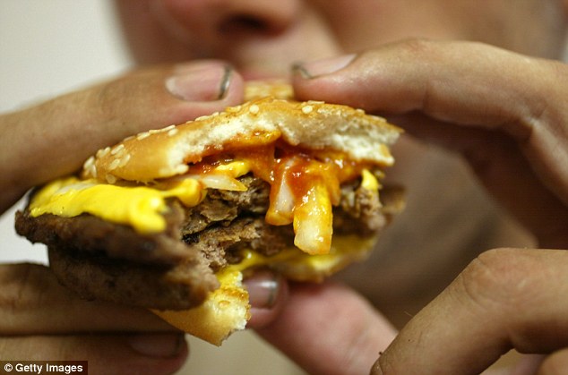 Man gorges on a Burger King burger