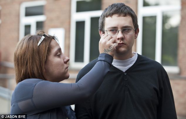 Parental grief: Amy Carter wipes the tears of her partner Scott Hellings as they left Bella's inquest 
