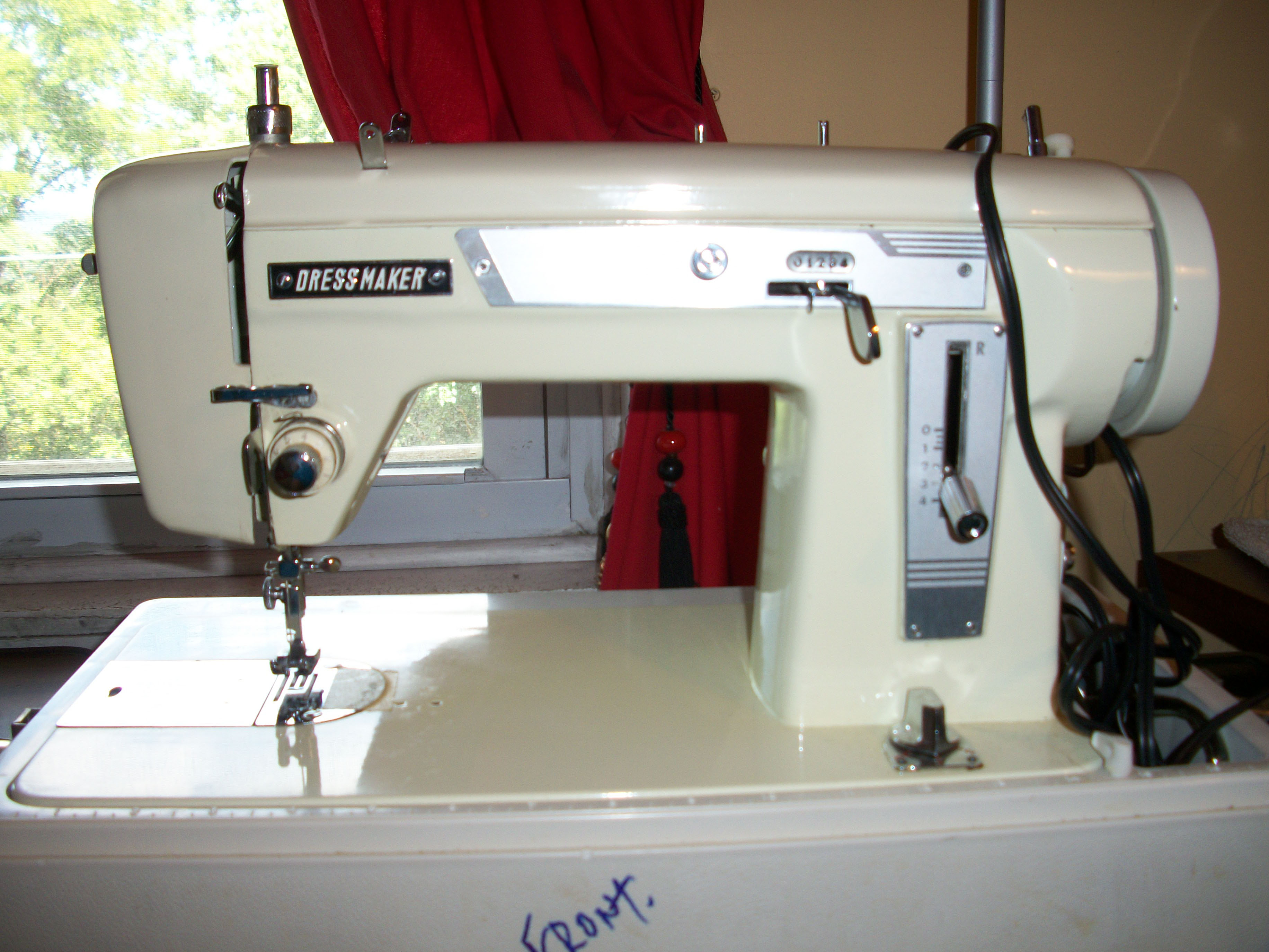 Dressmaker Sewing Machine: Singer.