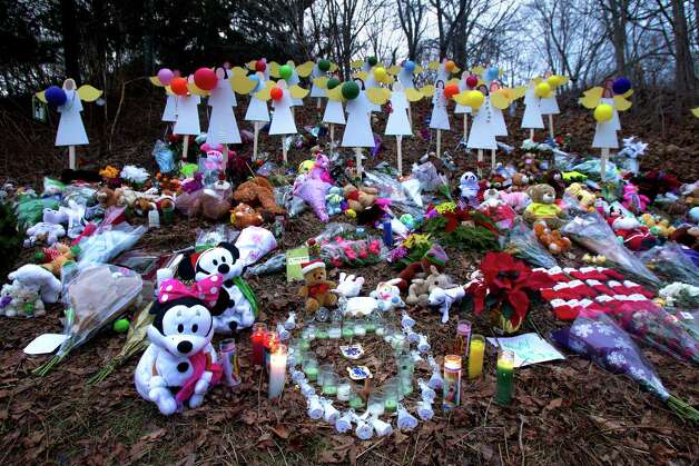 A memorial site  is seen Thursday, December 20, 2012 in Newtown, Conn., honoring the individuals who were killed during a shooting at Sandy Hook Elementary School last Friday. The school was evacuated after Adam Lanza opened fire killing 26 individuals, 20 whom were children. Photo: Cody Duty, Cody Duty/Hearst Newspapers / The News-Times